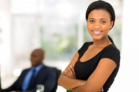 business woman smiling with arms crossed